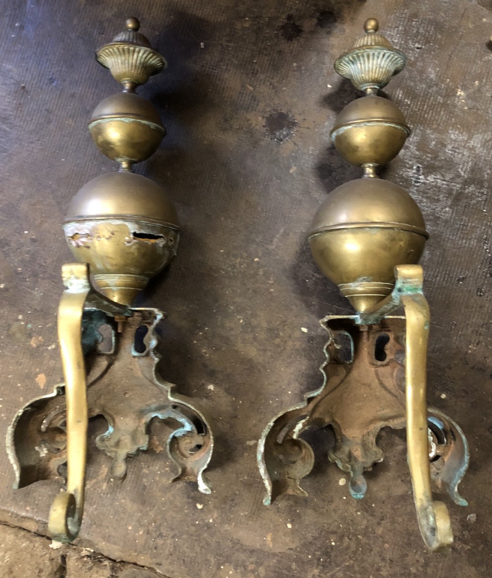 A large pair of brass andirons View II
