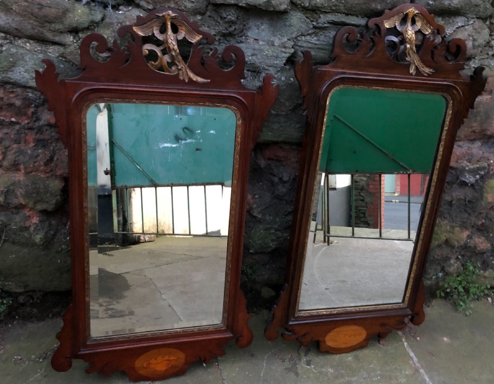 Pair of parcel gilt fretwork pier mirrors with ho ho birds and inlaid shells