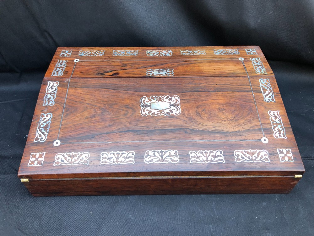 C19th rosewood writing slope inlaid with mother of pearl shell.