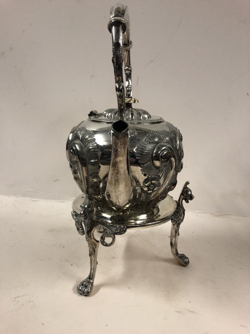 A silver plated kettle on stand 