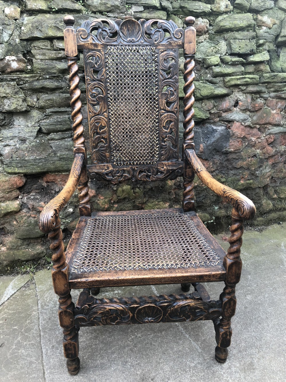 C17th Elbow chair (1680-90) caned with walnut frame