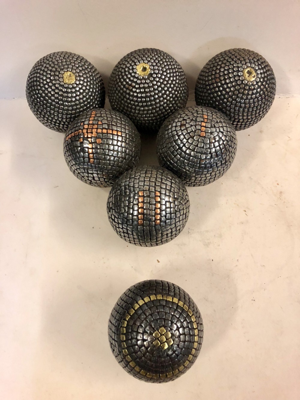 A collection of seven french pétanque boules.