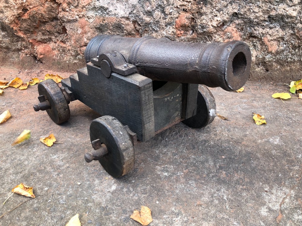 C19th small cannon on wood and cast iron stand  View II