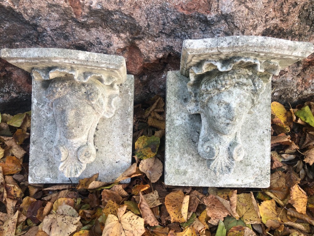 Early  20th Pair cast stone corbels mounted on stone backs  View IV
