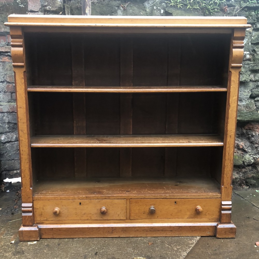 C19th golden oak floor standing bookcase with two drawers 