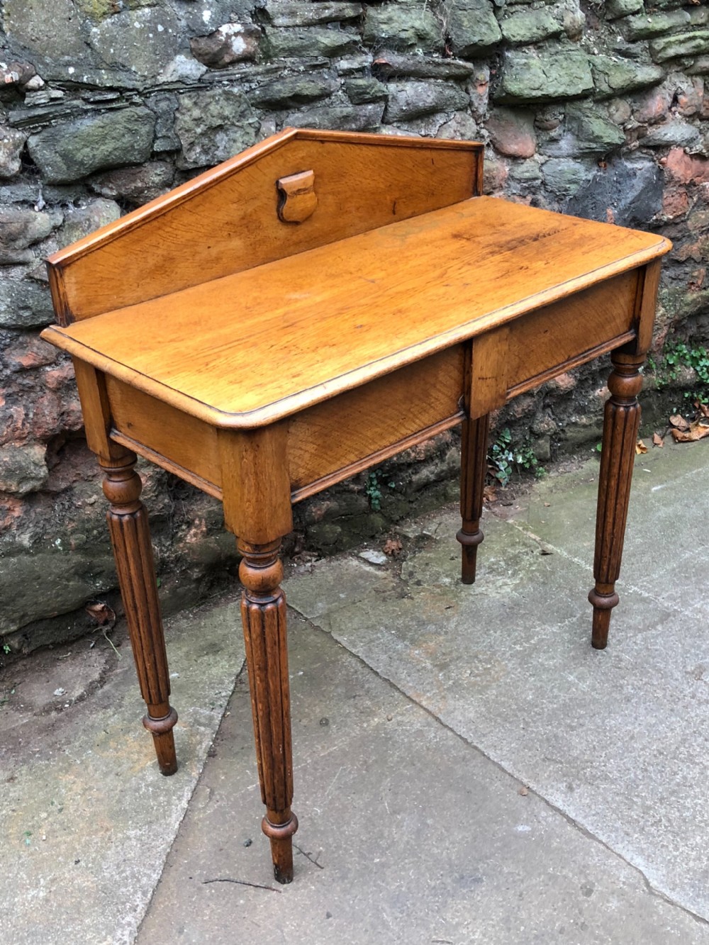 C19th golden oak hall table of small proportions on fluted legs View II