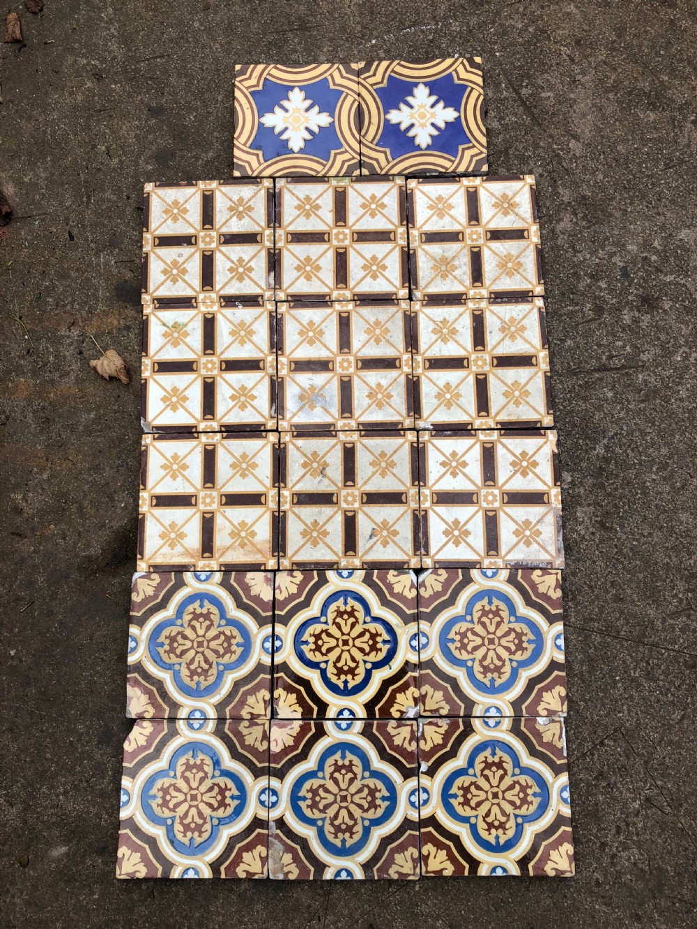 A small collection of 17 floor tiles