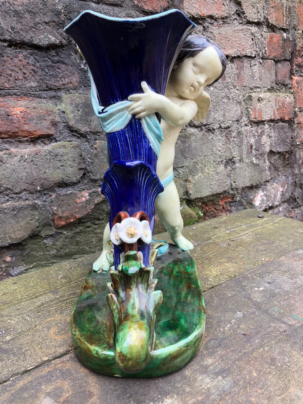 C19th large majolica cherub holding a cornucopia  View II