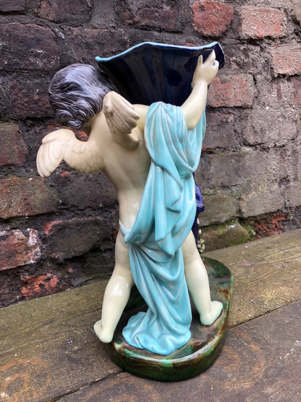 C19th large majolica cherub holding a cornucopia  View IV