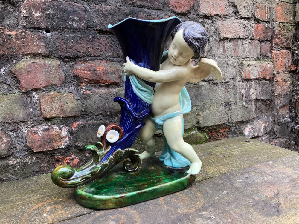 C19th large majolica cherub holding a cornucopia  View V