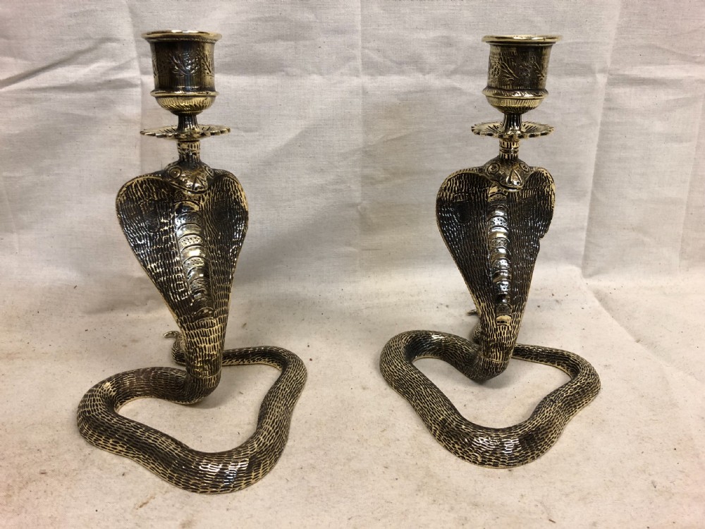 C19th pair of brass candlesticks shaped as cobras 
