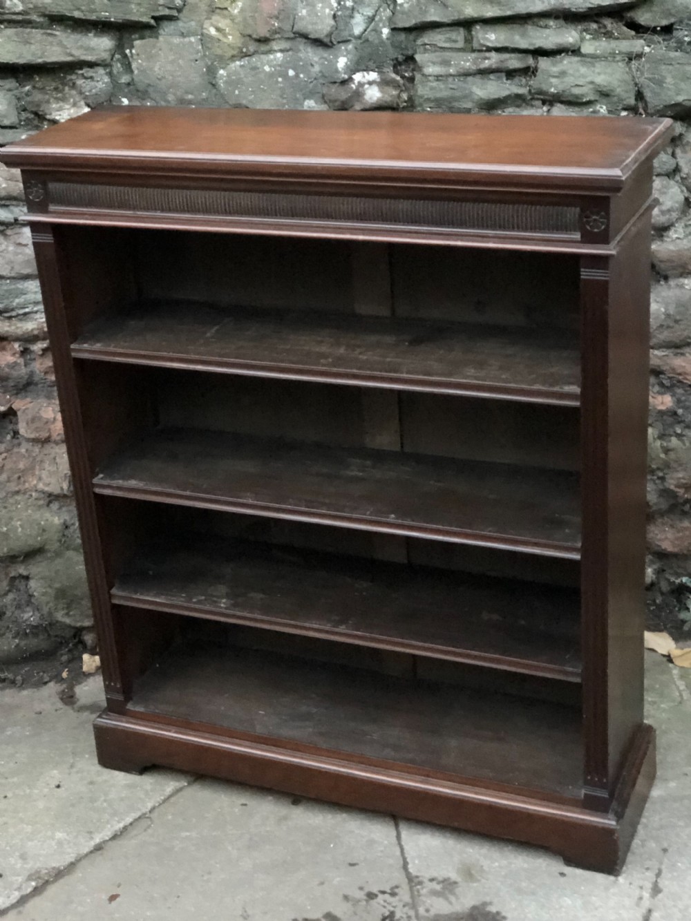 A small Victorian Walnut bookcase with three adjustable shelves 