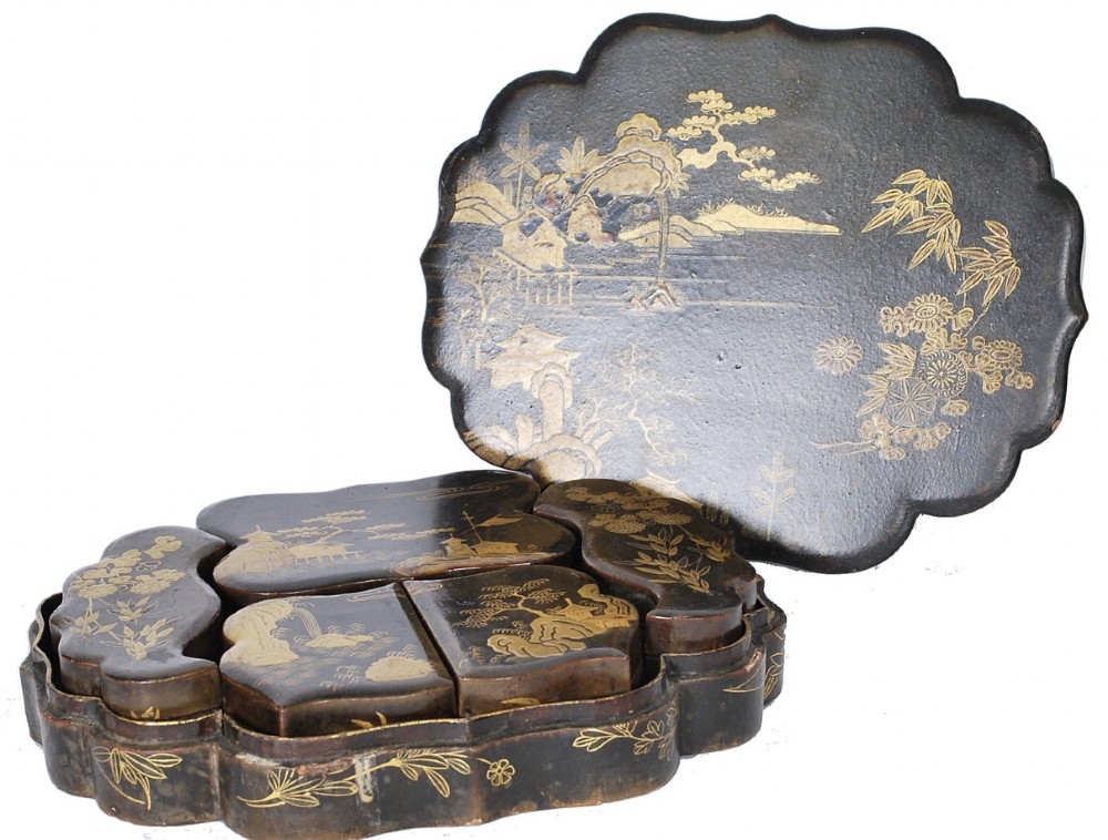 A C19th lacquered box with gilt chinoiserie decoration 