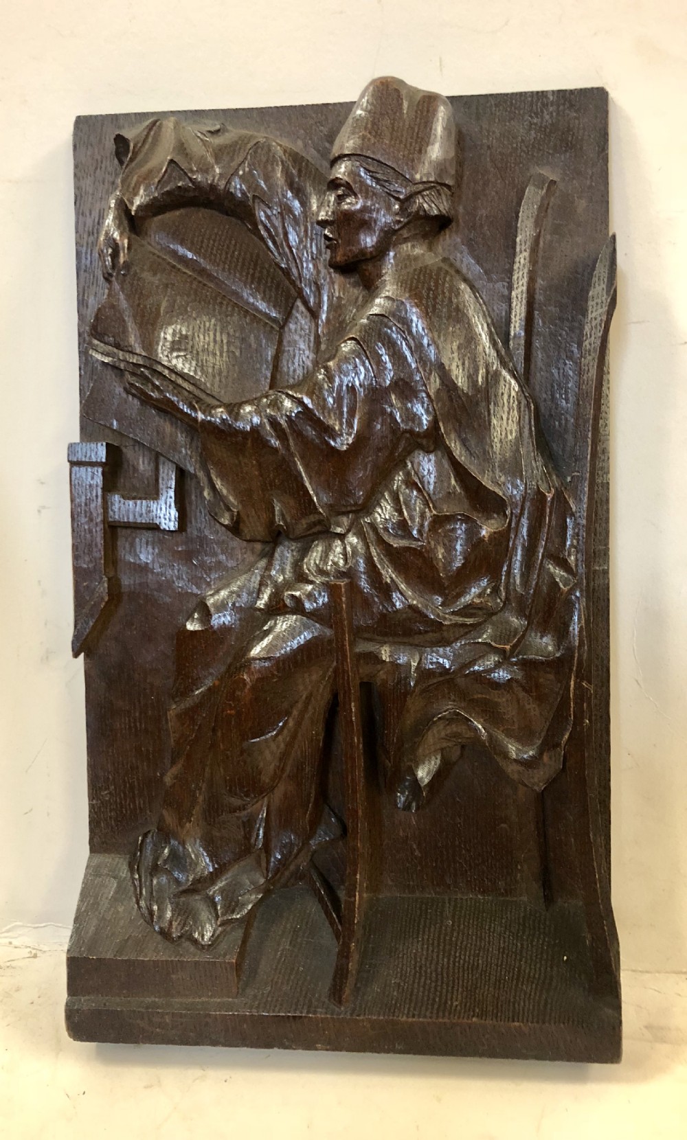 C18th relief carving in oak of a scholar