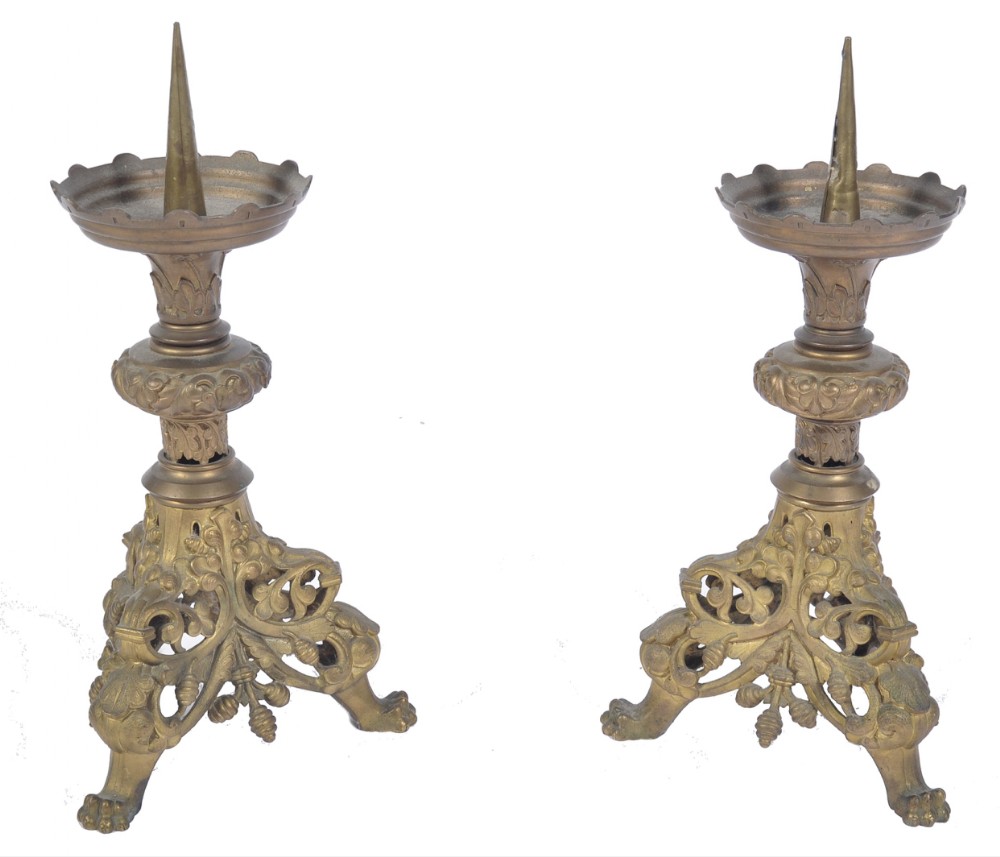 A pair of cast brass altar pricket sticks 