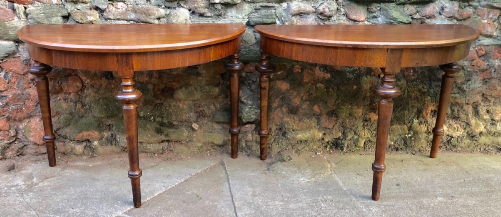 A good pair of Walnut Demi lune tables 