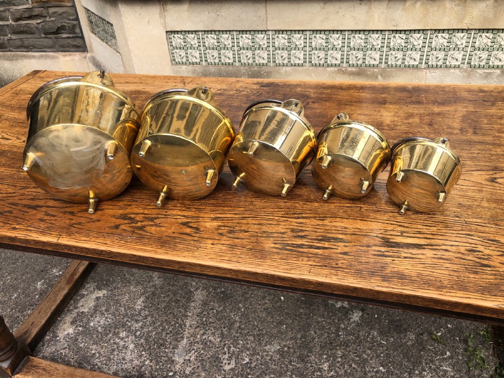 C19th graduating set of 5 brass cooking pans with feet  View X