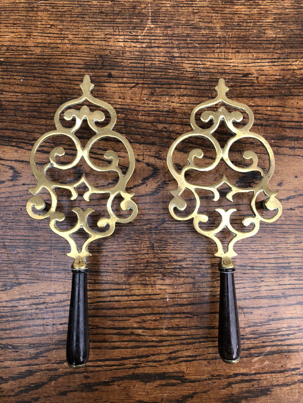 Pair of C19th laundry trivets 
