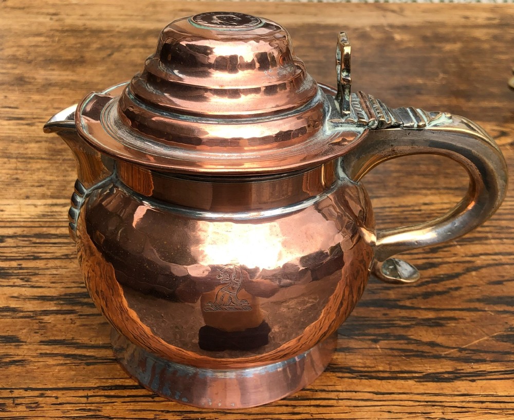 A George III copper lidded jug dated 1807