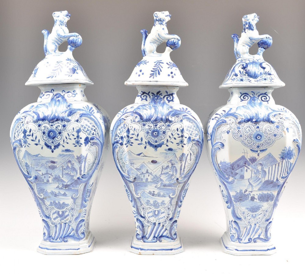 Garniture of Delft vases and cover 