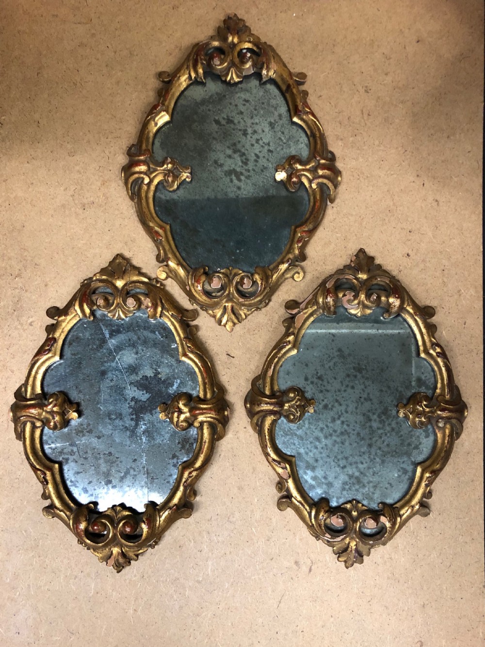 Three small carved giltwood mirrors  