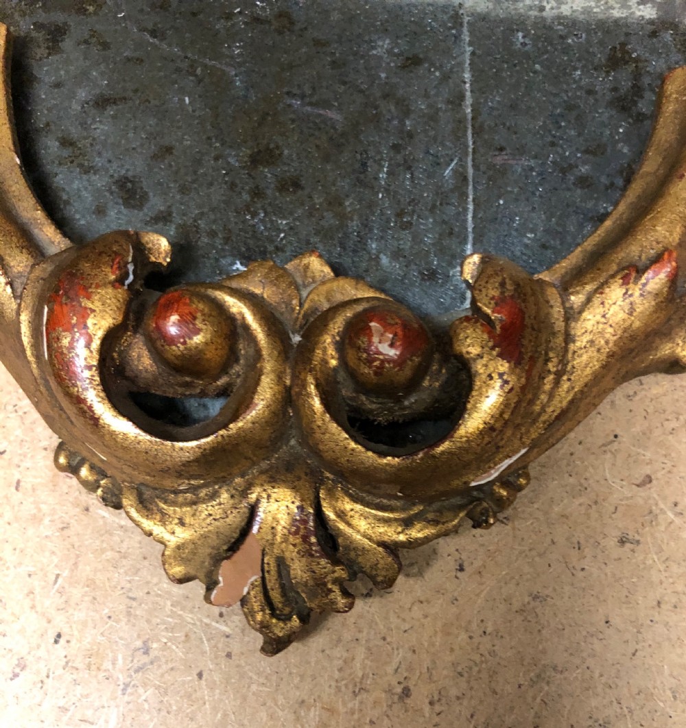 Three small carved giltwood mirrors   View II