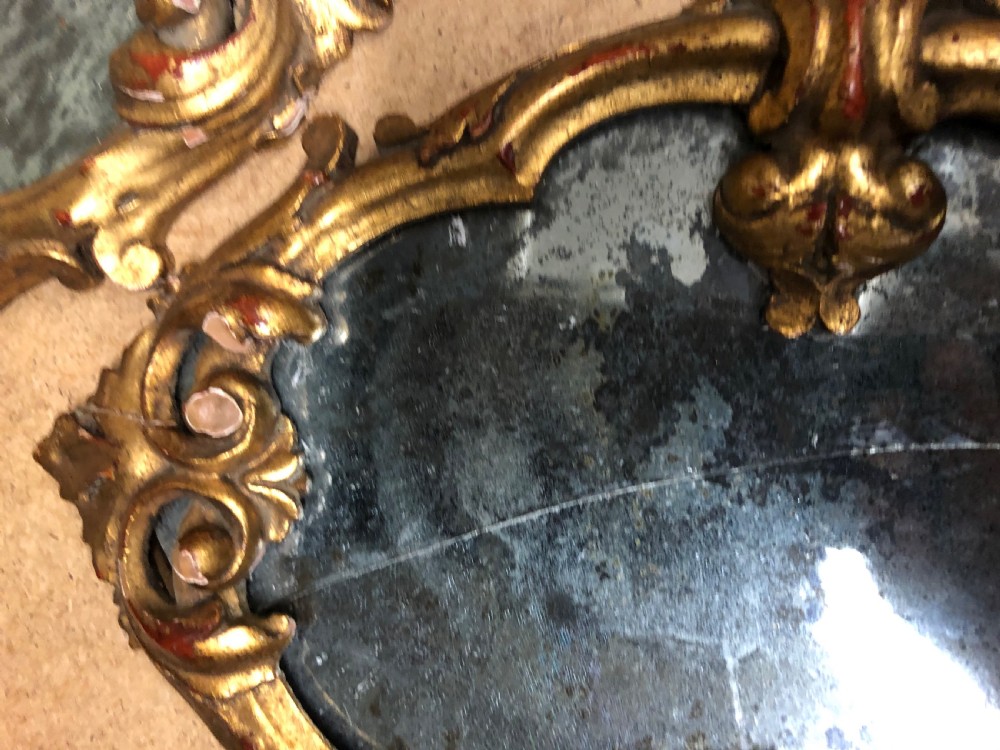 Three small carved giltwood mirrors   View III