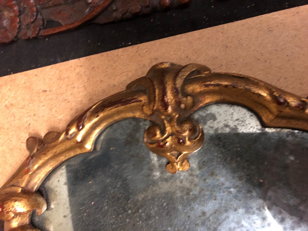 Three small carved giltwood mirrors   View V