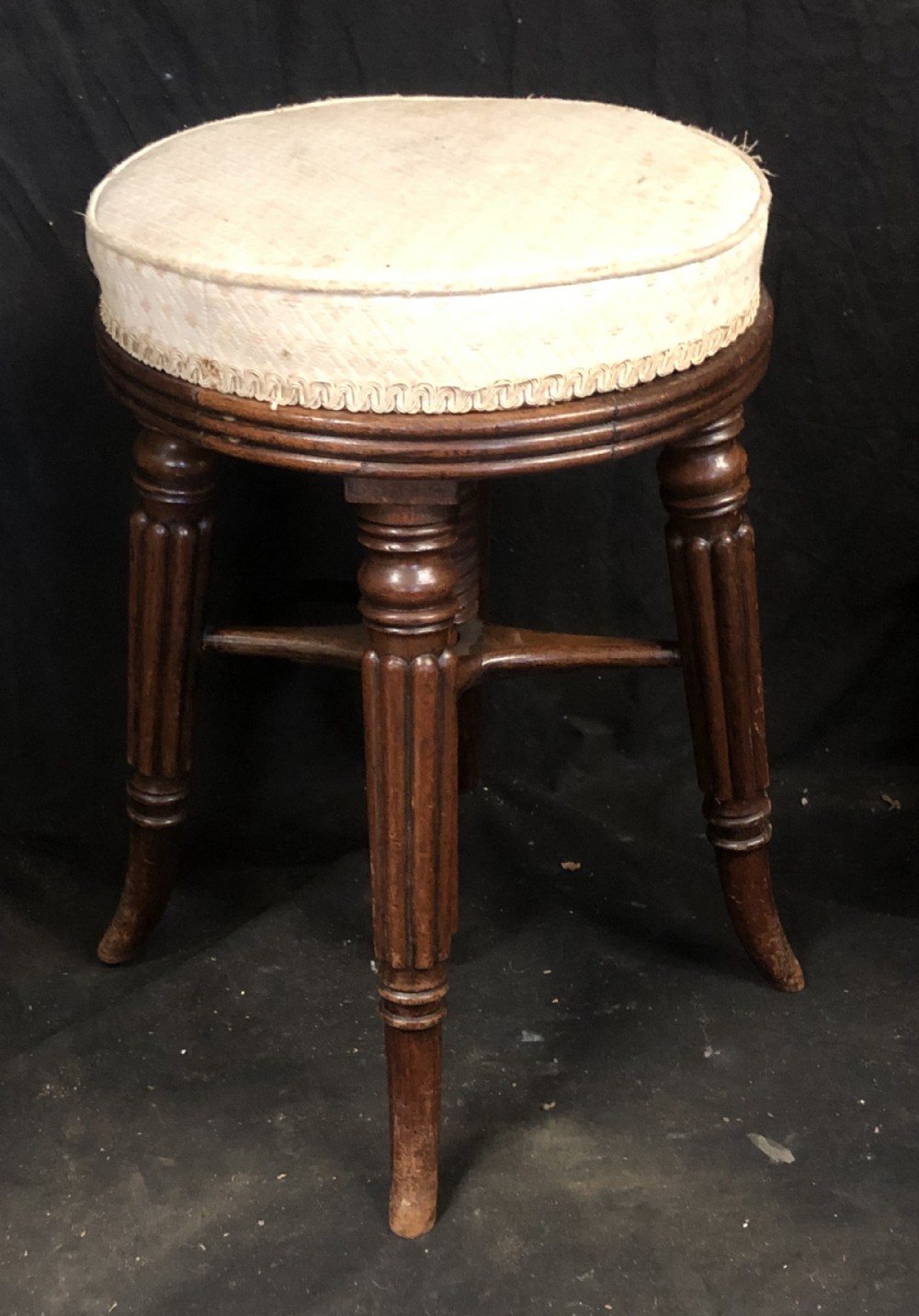 A regency revolving piano stool