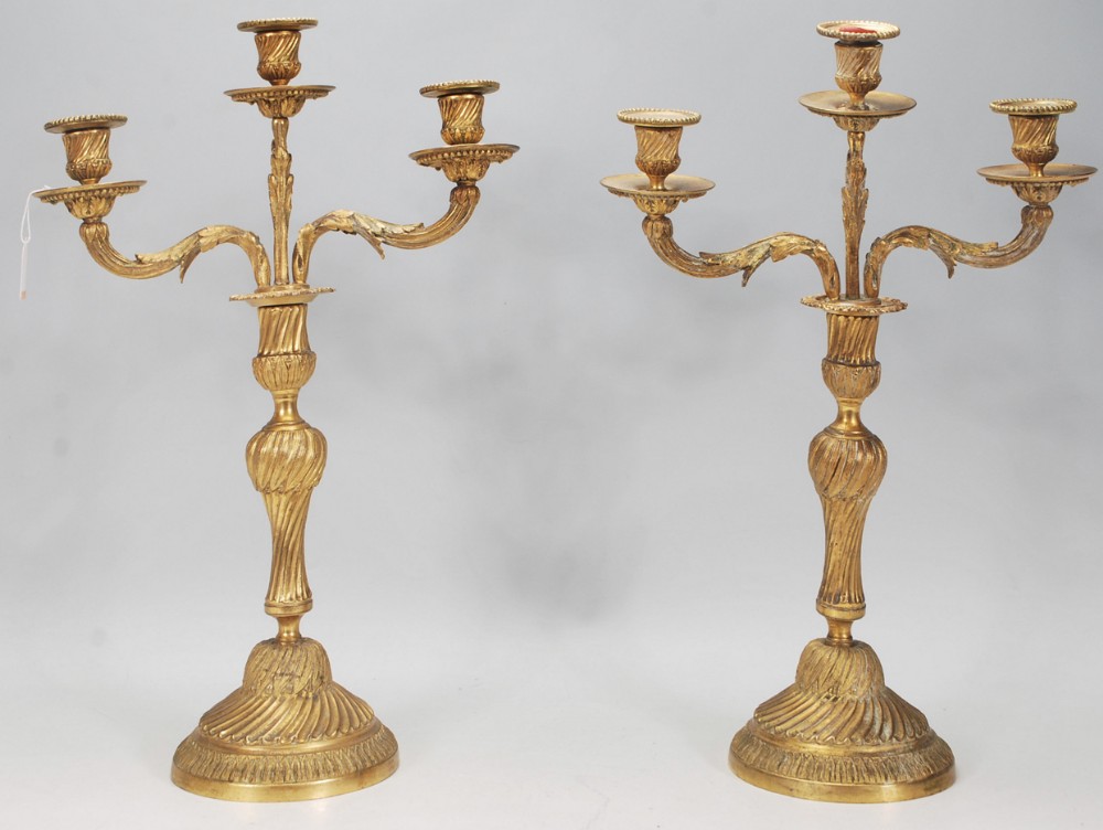 Pair of ormolu three armed candelabra