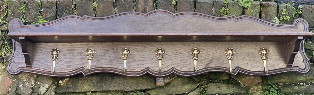 Wall mounted set of coat hooks and shelf 