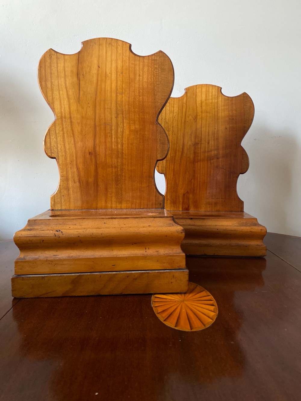 Near pair of satinwood early C19th plate stands 