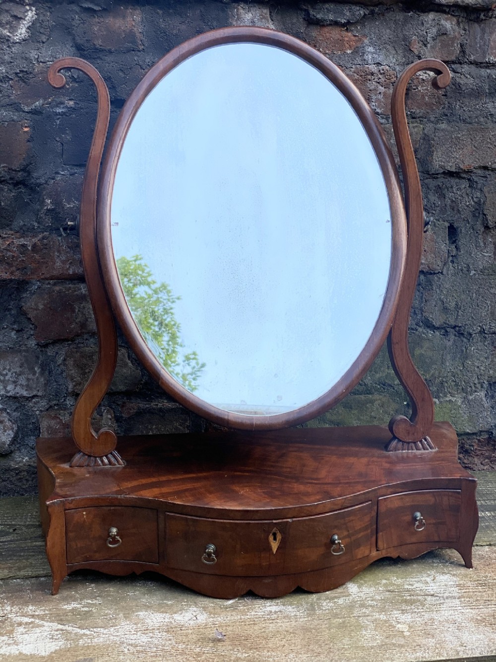 Early C19th serpentine fronted toilet mirror with oval mirror 