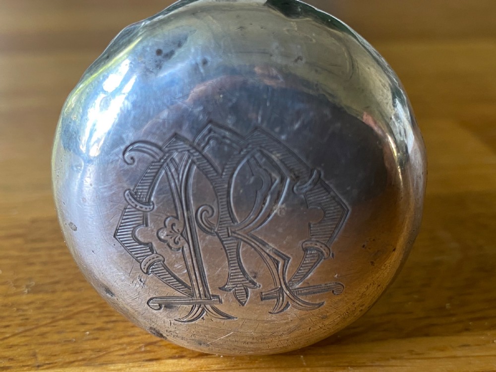 A bulbous white metal topped cane monogrammed RM or MR View IV