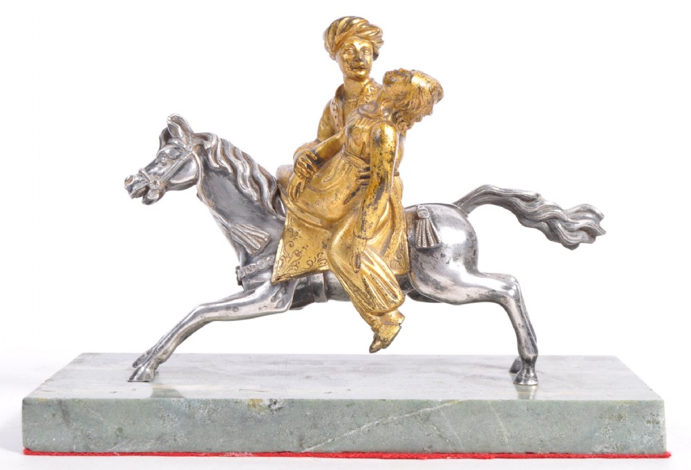 C19th bronze gold and silver plated couple on horseback.