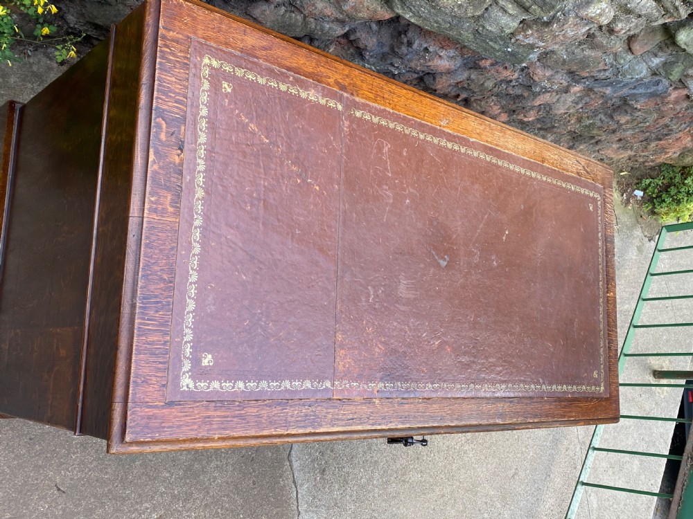 C19th oak pedestal desk of 9 drawers  View II