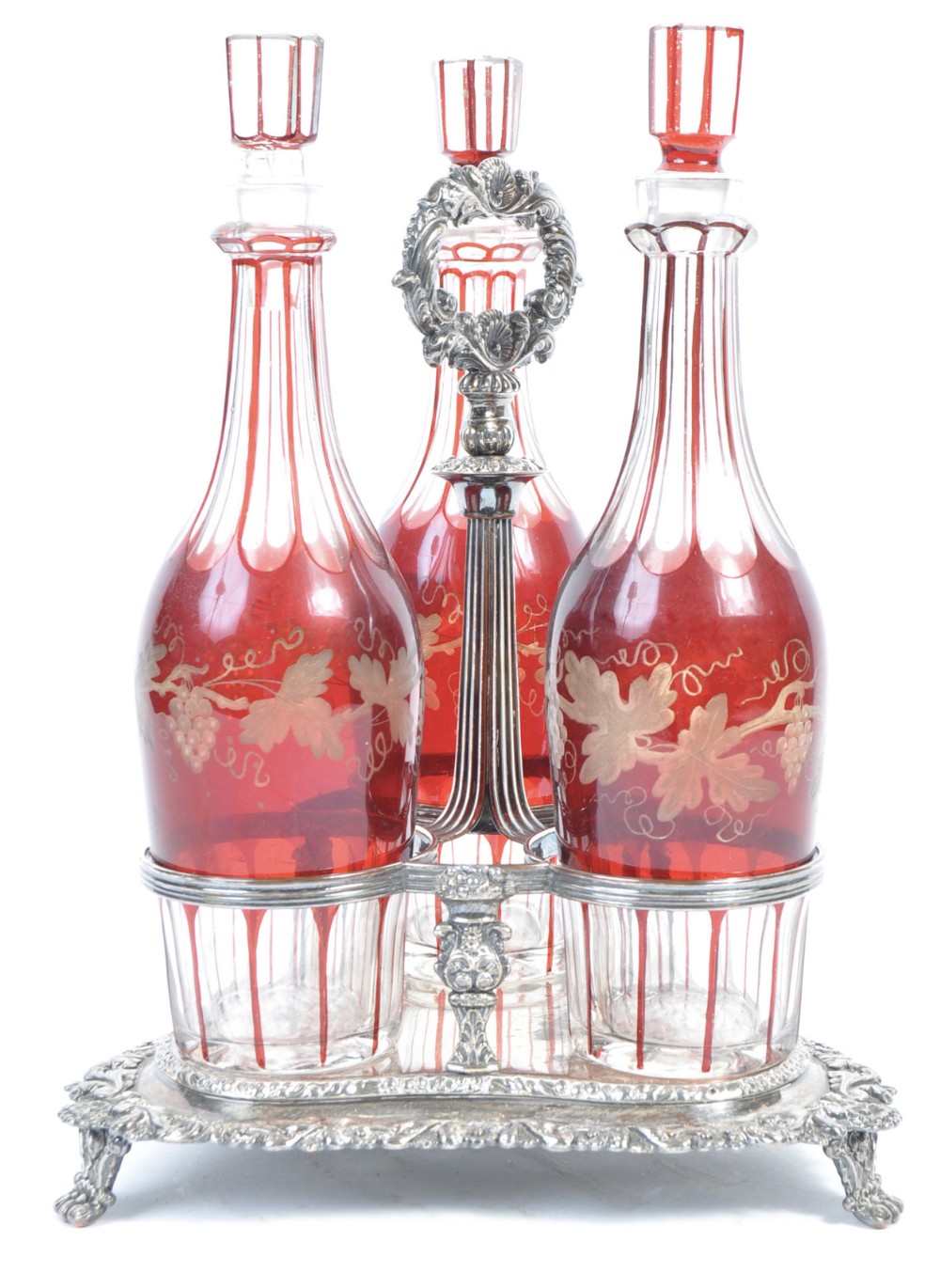 Victorian three bottle decanter carrier with three ruby cut glass decanters 