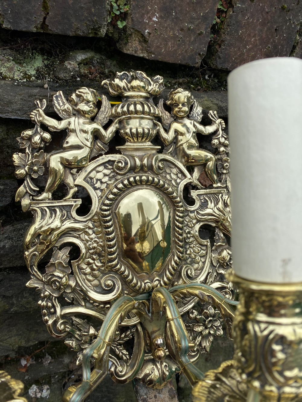 A three armed brass wall light  View II
