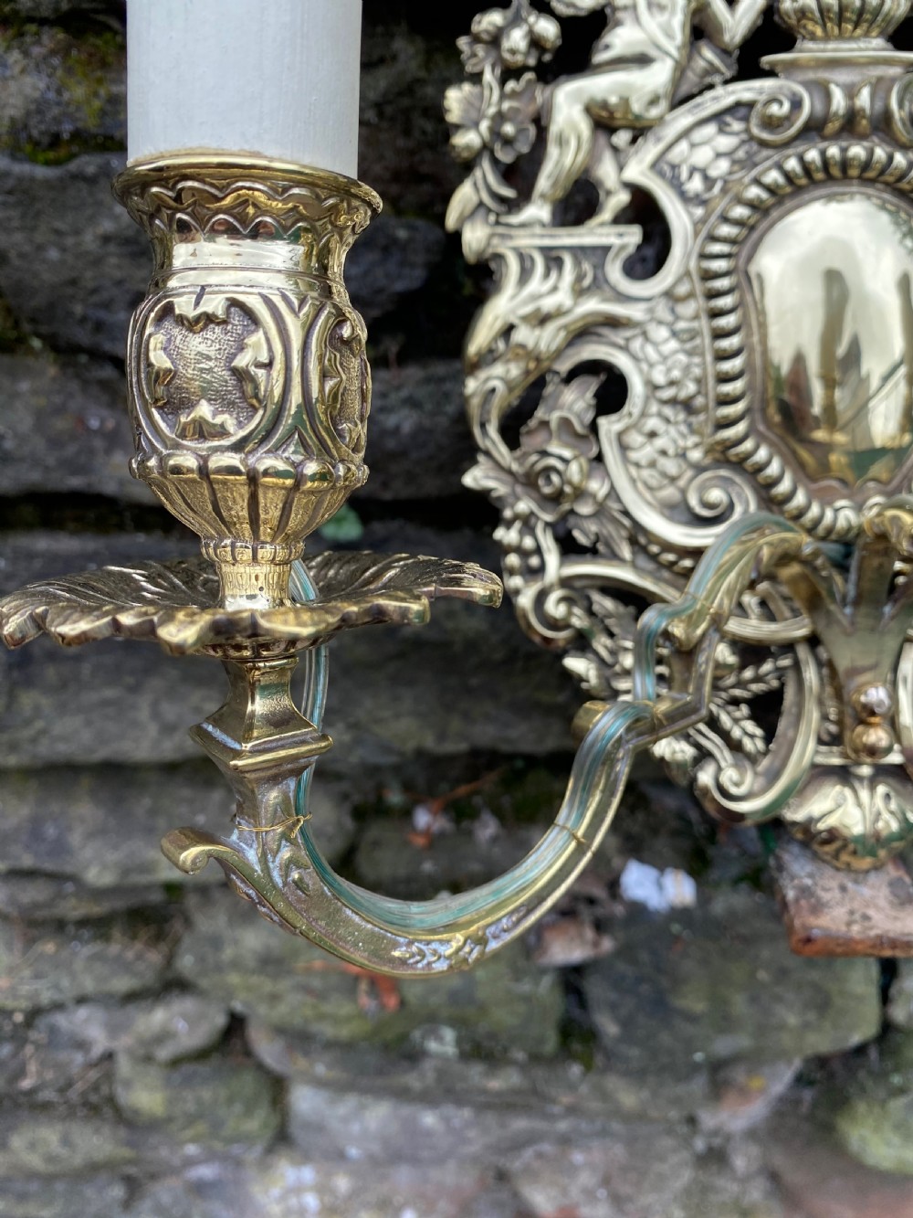 A three armed brass wall light  View III