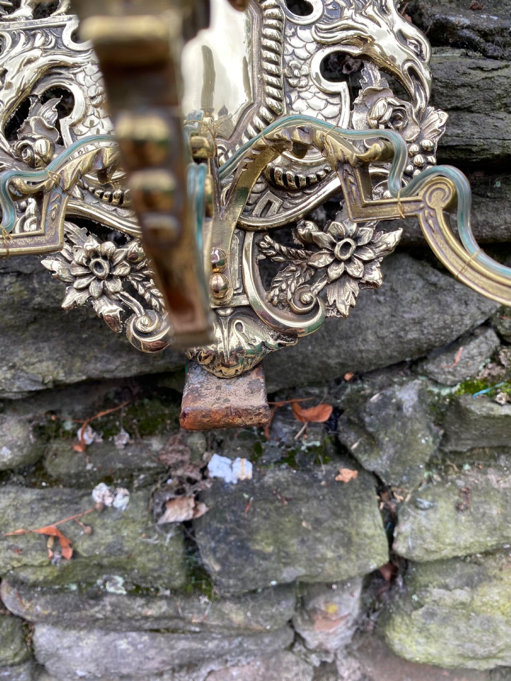 A three armed brass wall light  View VI