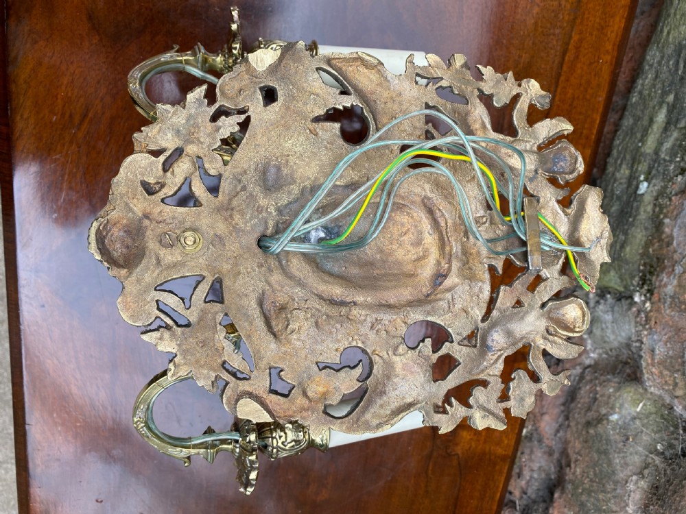 A three armed brass wall light  View VII