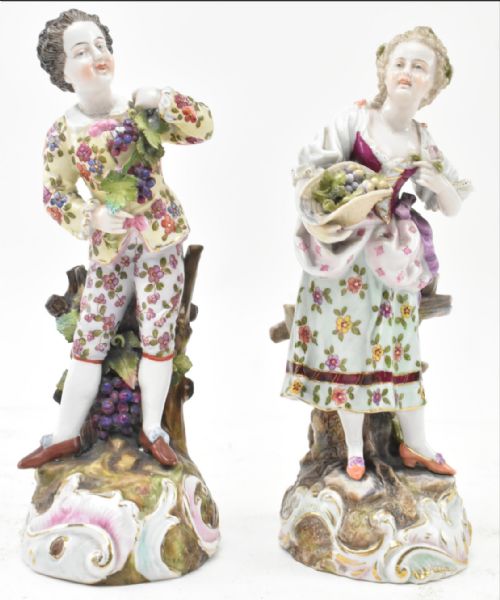 Pair of volkstedt figures of a boy and a girl 