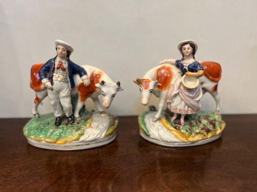 Pair of Staffordshire cow with a milkmaid and herdsman 