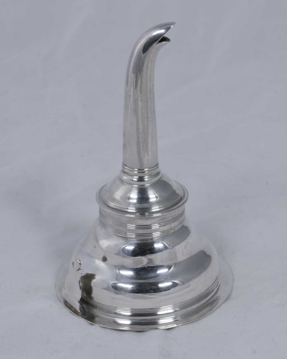 A polished sterling silver wine funnel featuring a flared bowl with reeded trim and a curved tapering spout.