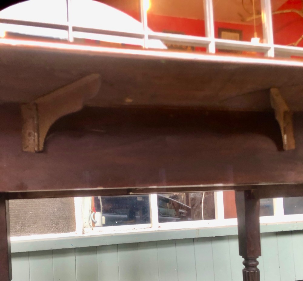 An antique oak chapel table featuring a rectangular drop-leaf top, a single end drawer with a metal handle, and dark turned reeded legs. View VI
