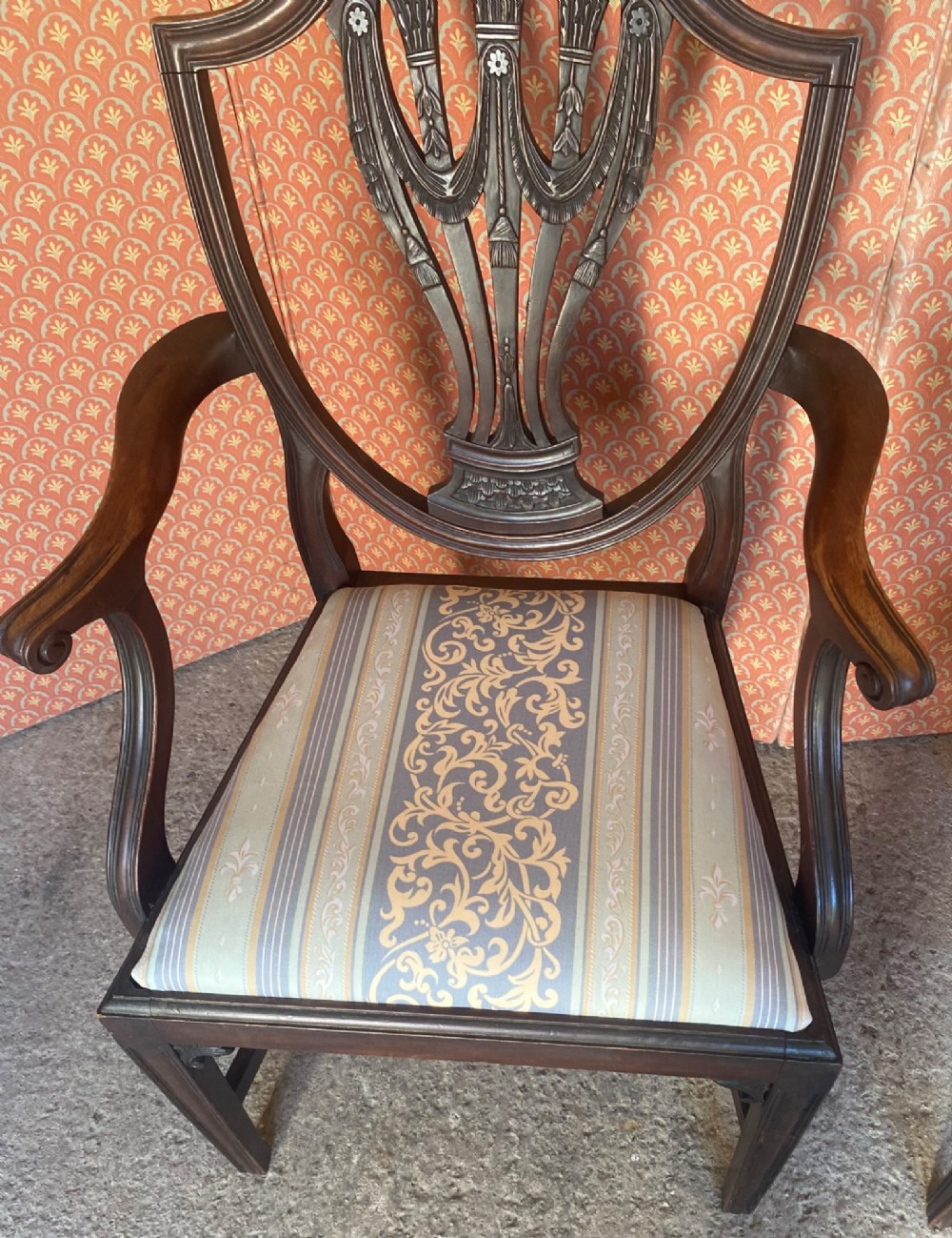 Set of eight mahogany Regency dining chairs featuring openwork carved shield backs and patterned upholstered seats. View III