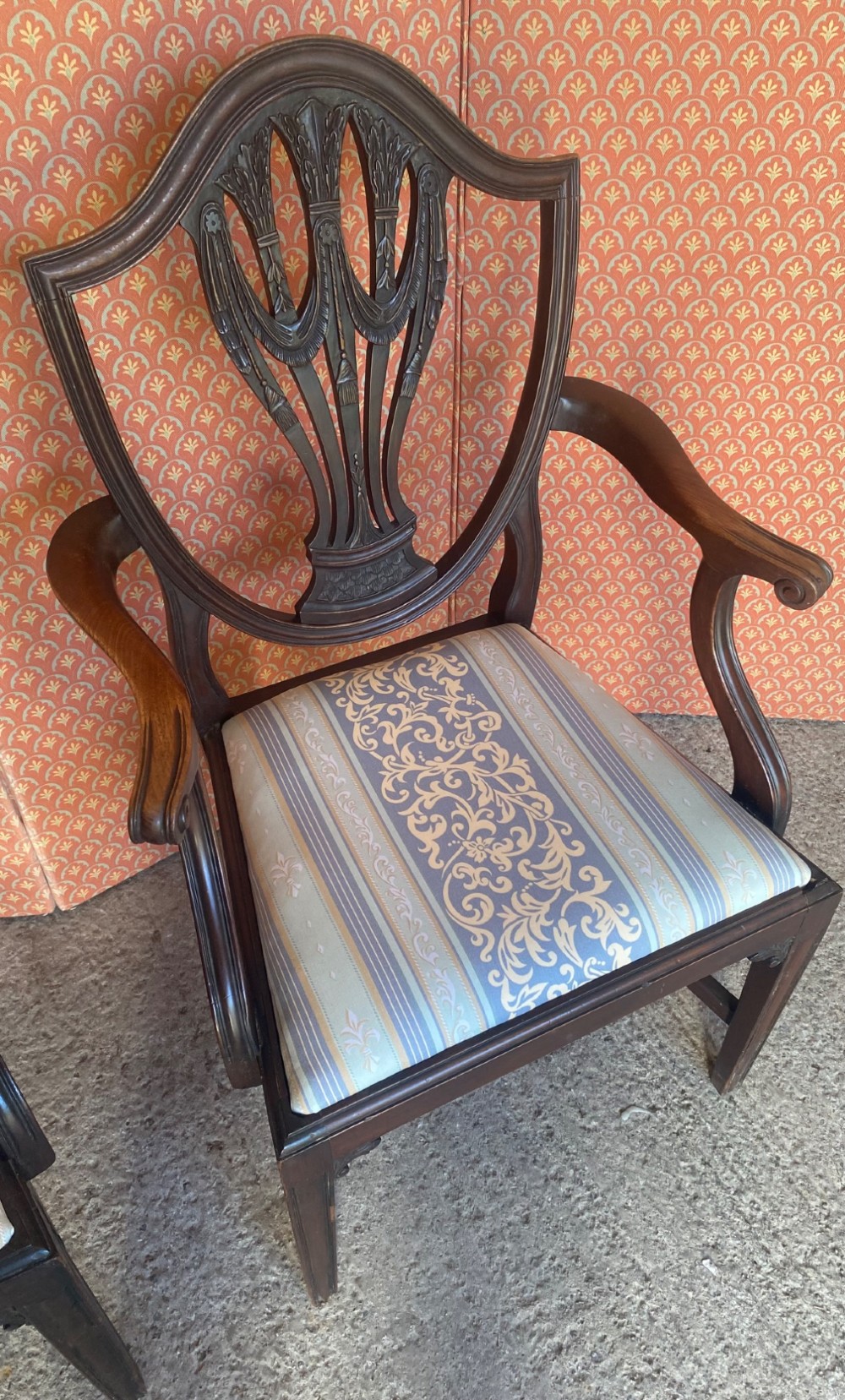 Set of eight mahogany Regency dining chairs featuring openwork carved shield backs and patterned upholstered seats. View VI