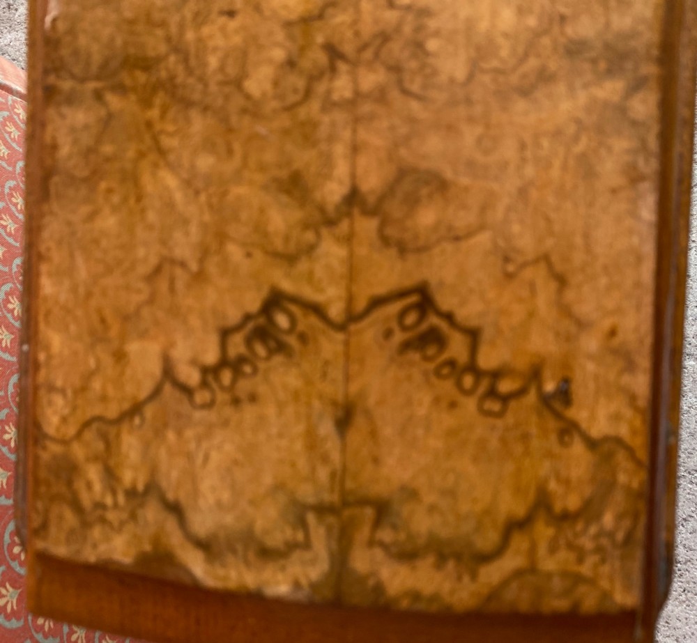 A Victorian burr walnut drop leaf table with turned twin column supports, a stretchered base, scrolled feet on brass castors, and a figured veneer surface. View IV