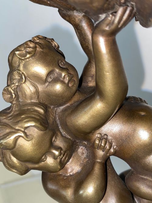 fig 1. Bronze Cherubs holding Shell. Circa 1900