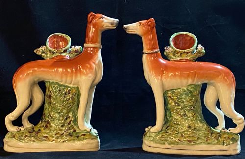 A Pair of Staffordshire Pottery Models of Greyhounds.